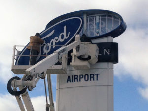 FORD-1 man installing sign face